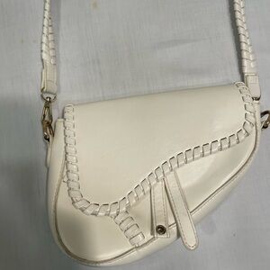 Elegant Cream Saddle Bag with whipstitch trim off white leather crossbody bag